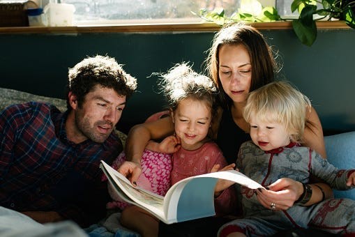 Young Family Reading Together